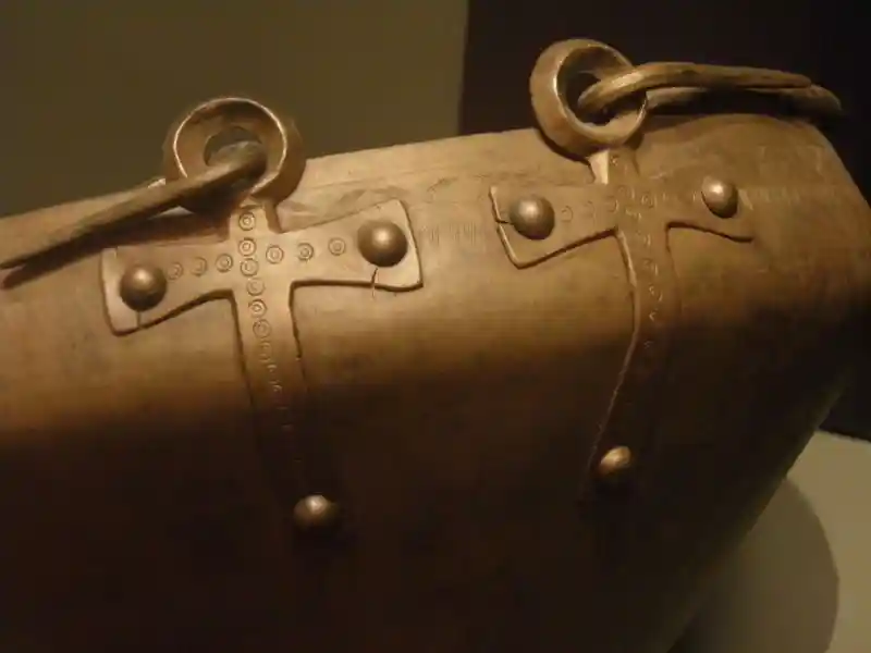 An ankh on the handle of a bronze vessel